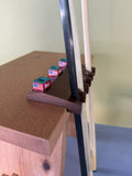 Walnut Pool Cue Holder with five different pockets, with three pockets to place your chalk, made in the United States. 