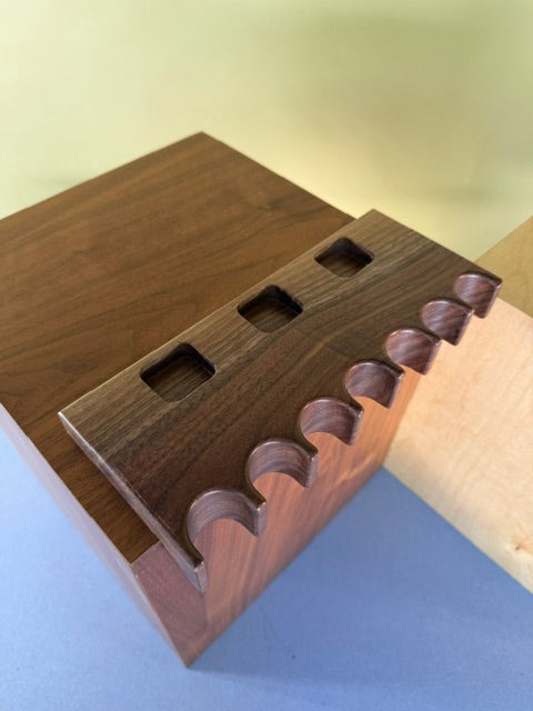 Walnut Pool Cue Holder with multiple slots to allow your pool cues to stand. Three different pockets for chalk. 